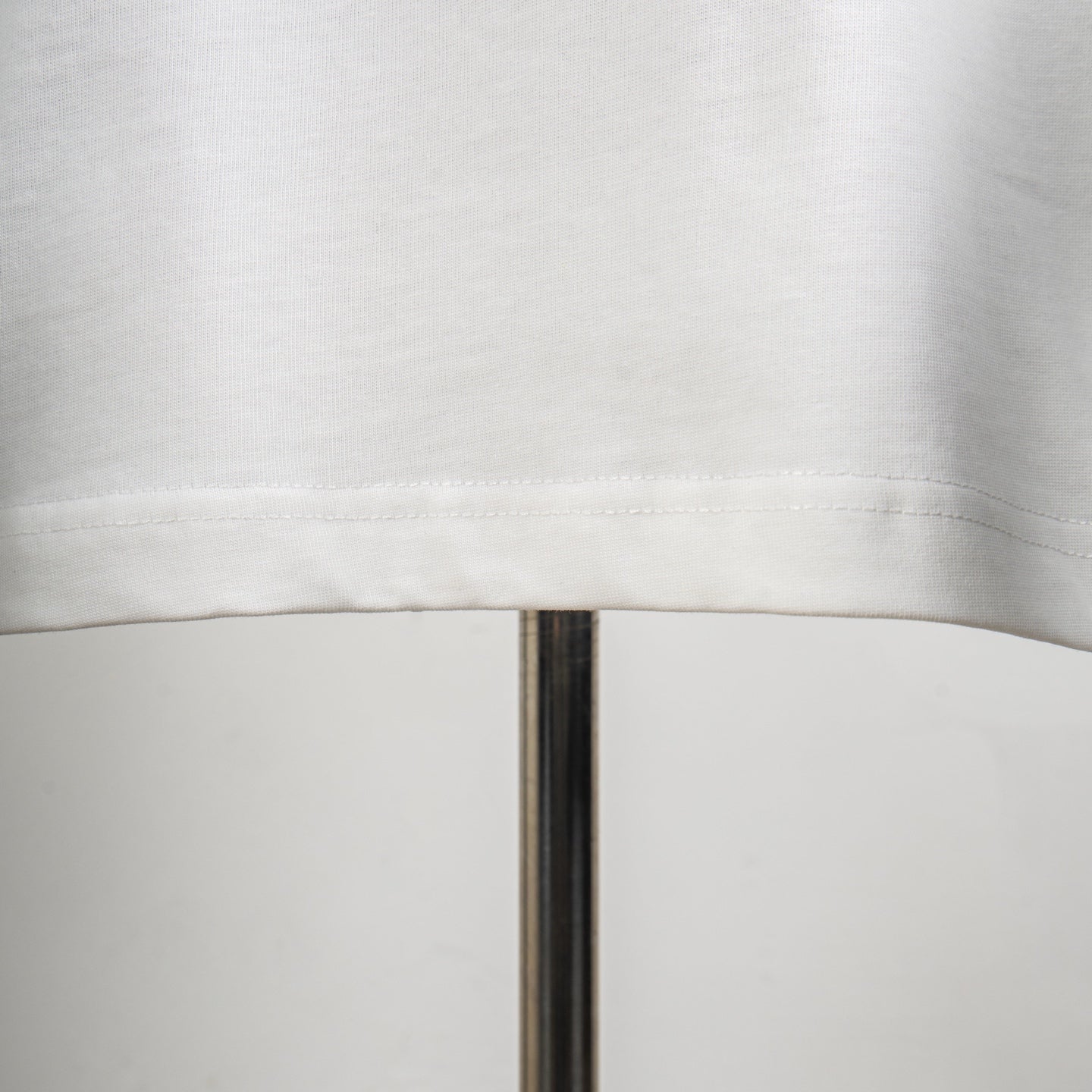White T-shirt with curved hem seam detail