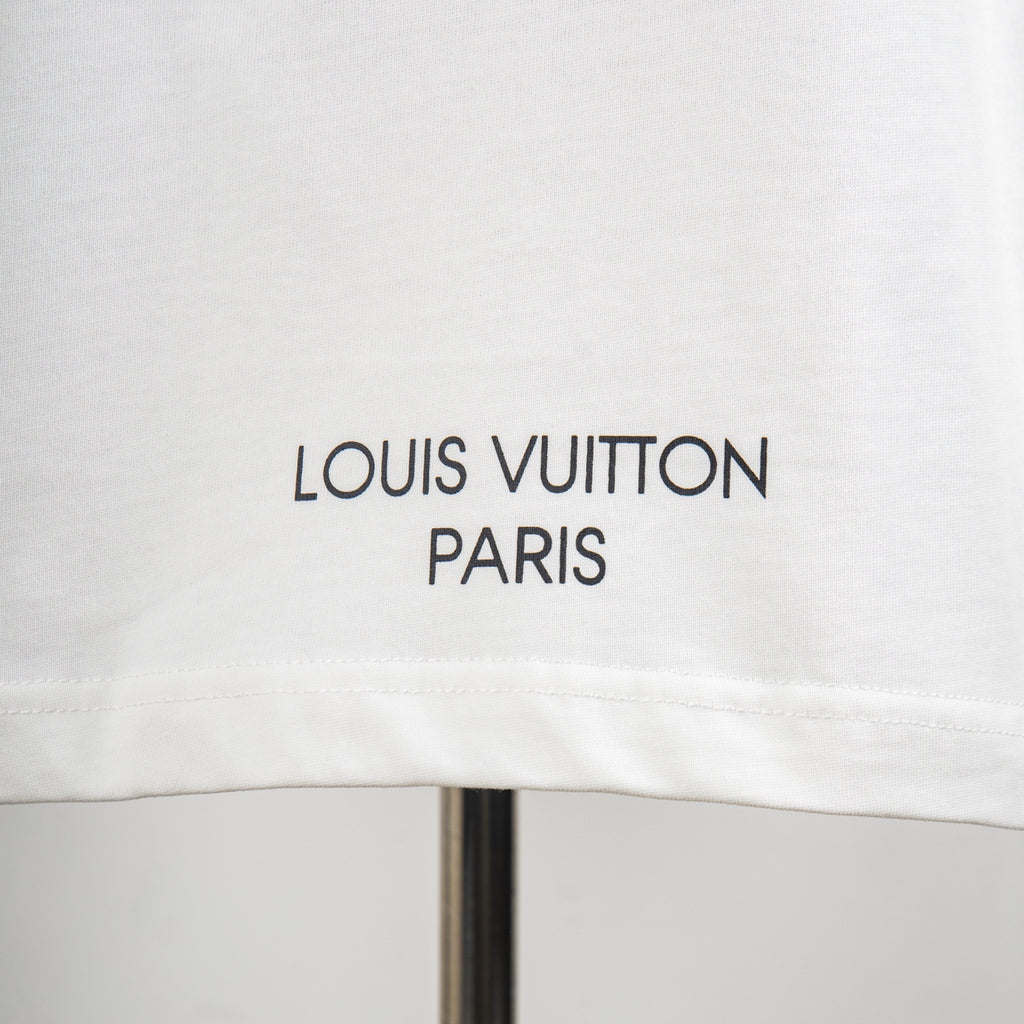 White T-shirt with 'LOUIS VUITTON PARIS' text print near hem