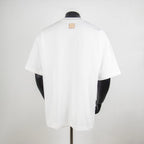 White T-shirt back view with small leather brand patch near collar