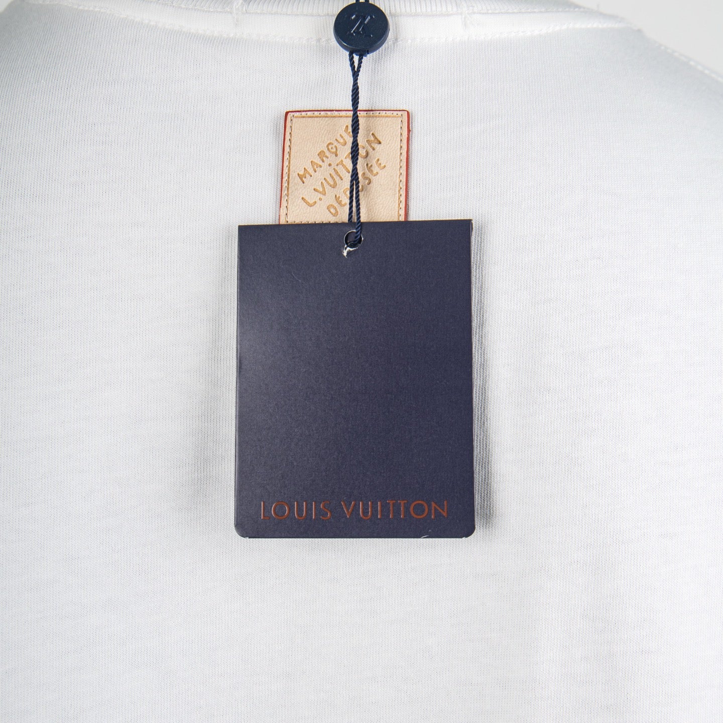 White T-shirt with Louis Vuitton neck tag and hanging brand card