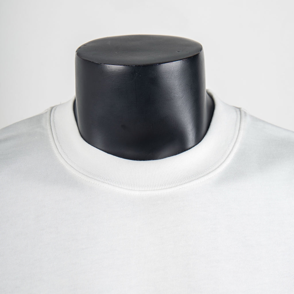 White T-shirt neckline close-up with ribbed crew collar