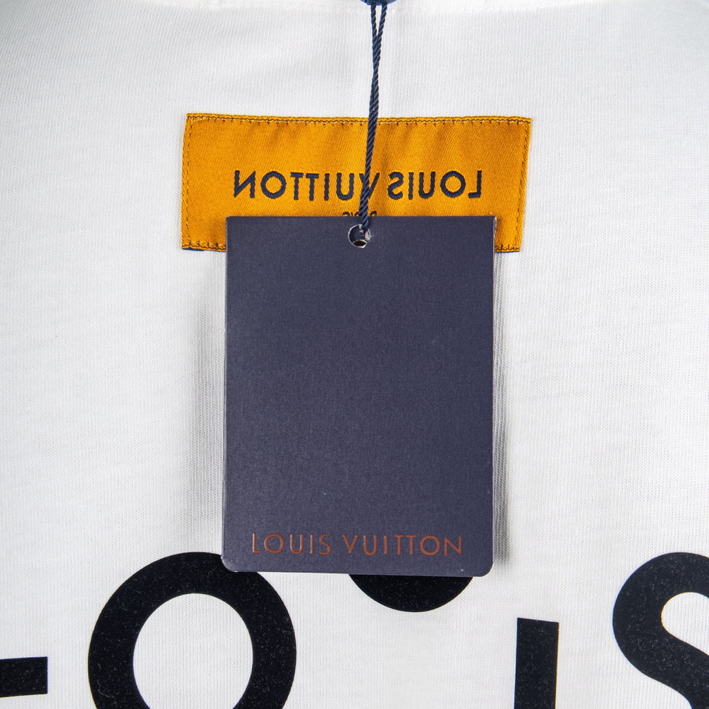 Louis Vuitton T-shirt with orange neck label and attached dark hang tag