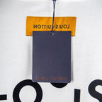 Louis Vuitton T-shirt with orange neck label and attached dark hang tag