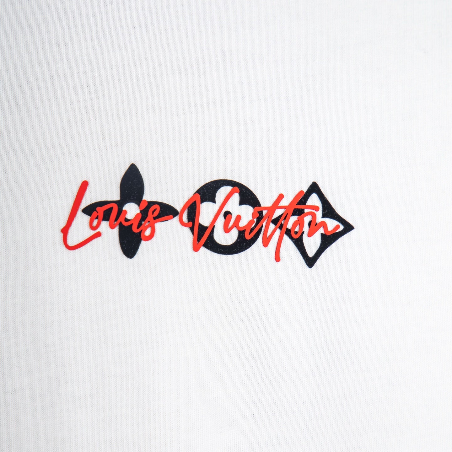 Louis Vuitton T-shirt front logo detail with red-and-black script print