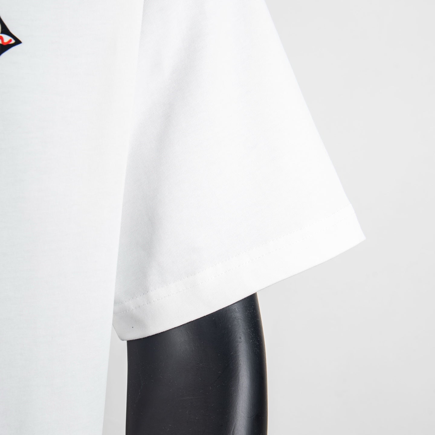 White Louis Vuitton T-shirt showing short sleeves and curved hem