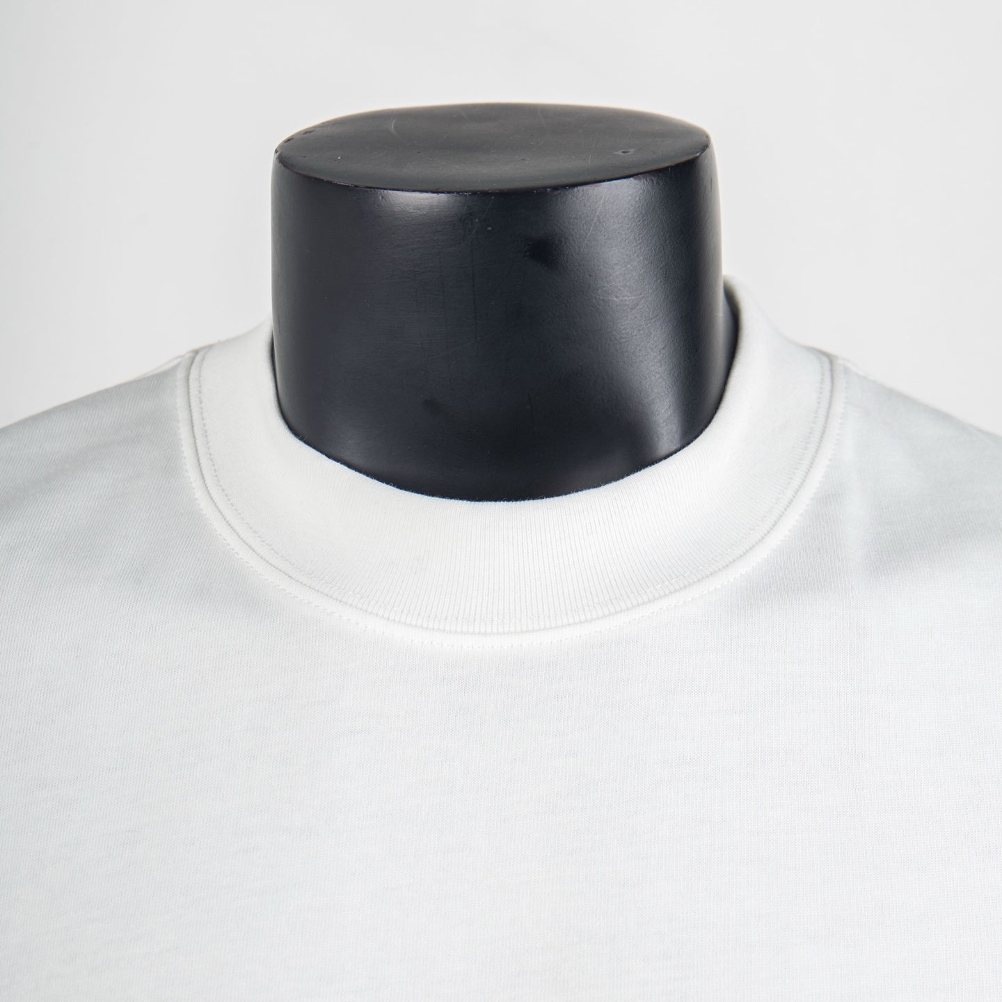 White Louis Vuitton T-shirt close-up of crew neckline and collar seam
