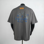 Louis Vuitton short-sleeve t-shirt, dark gray, back view with blue logo graphic and yellow label