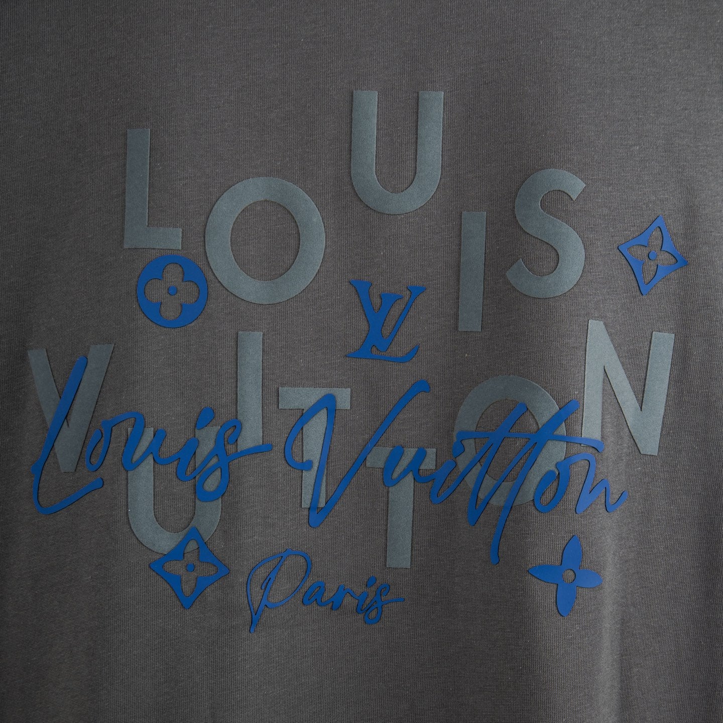 Dark gray T-shirt with large blue lettered graphic and star accents