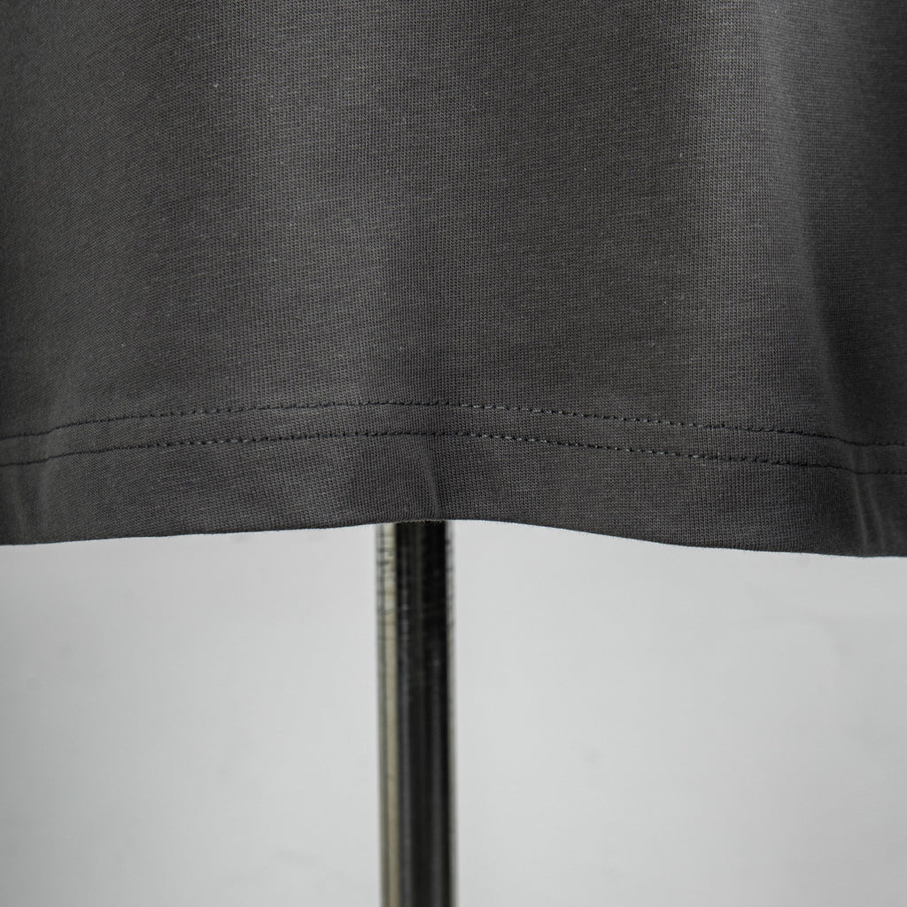 Dark gray T-shirt hem stitching close-up