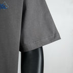 Dark gray T-shirt hem and sleeve edge detail on a mannequin