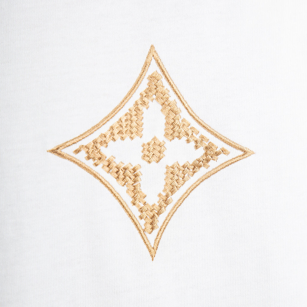 Gold embroidered diamond logo on white short-sleeve T-shirt front