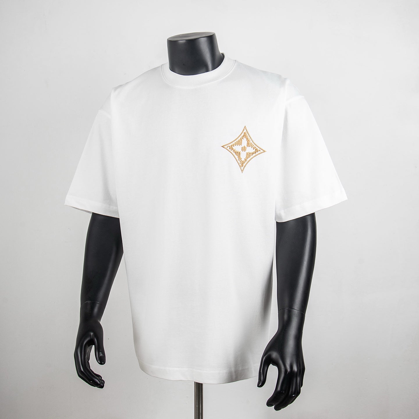 Louis Vuitton white T-shirt with gold diamond logo on chest