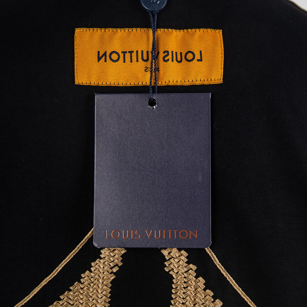 Louis Vuitton black T-shirt hang tag and gold diamond embroidery near hem
