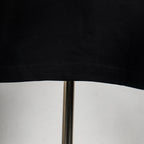Louis Vuitton short-sleeve T-shirt hem with visible stitching on black fabric
