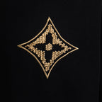 Louis Vuitton short-sleeve T-shirt, close-up of gold diamond logo embroidery