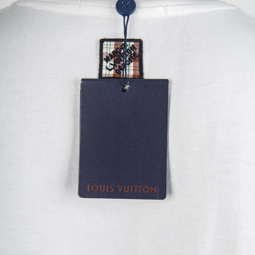 White T-shirt with attached navy Louis Vuitton hang tag