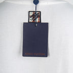 White T-shirt with attached navy Louis Vuitton hang tag
