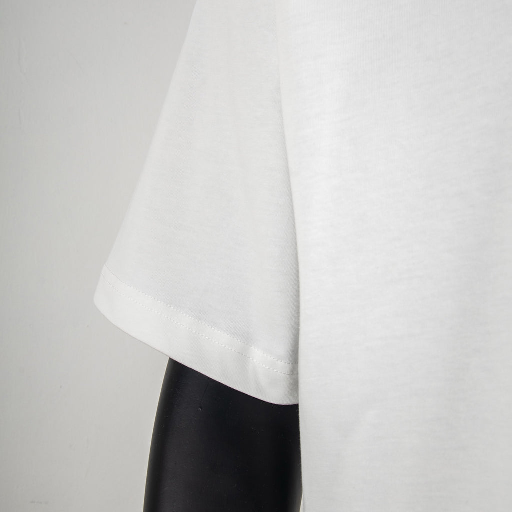 Givenchy white T-shirt side view with straight hem and short sleeves