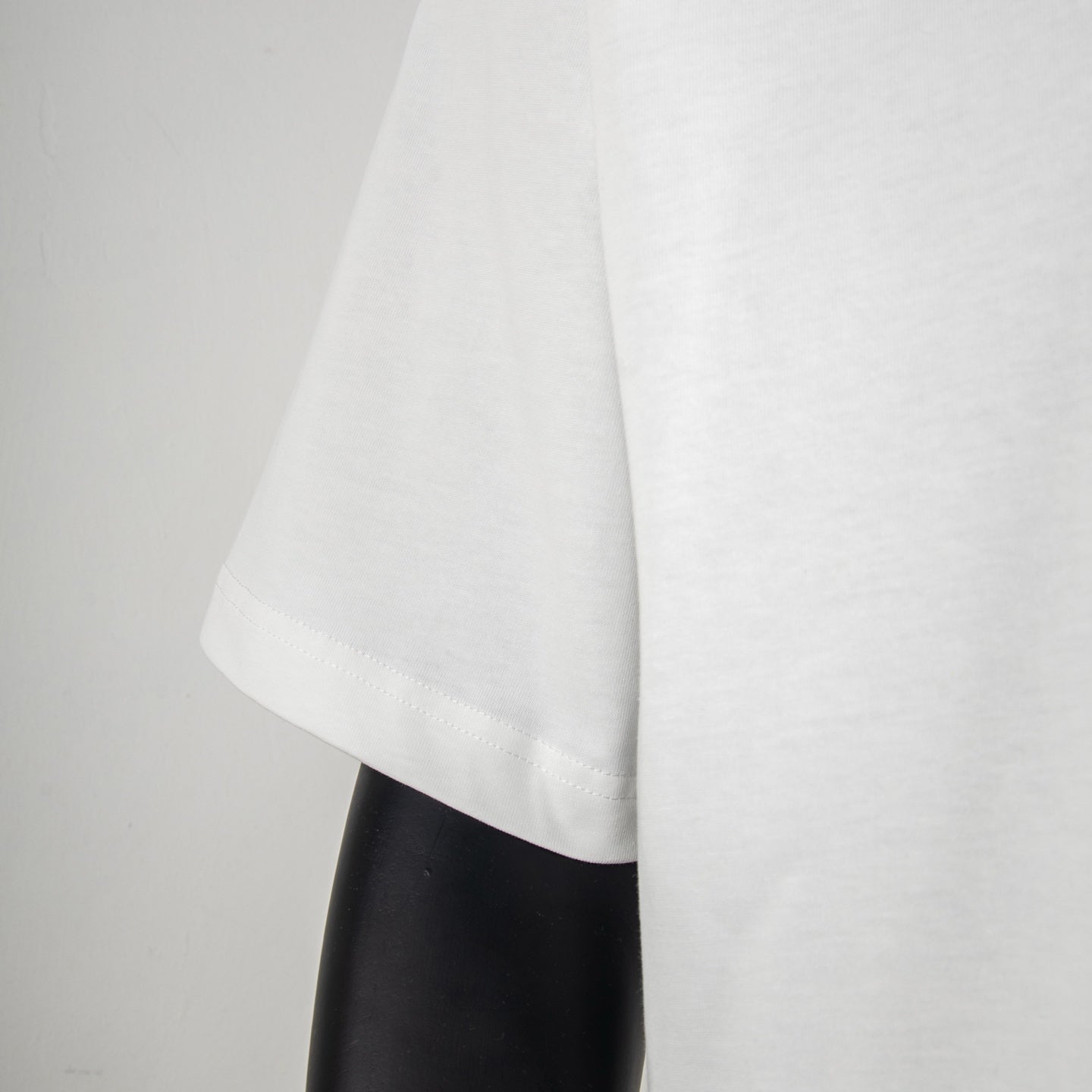 Givenchy white T-shirt hem and short sleeve view