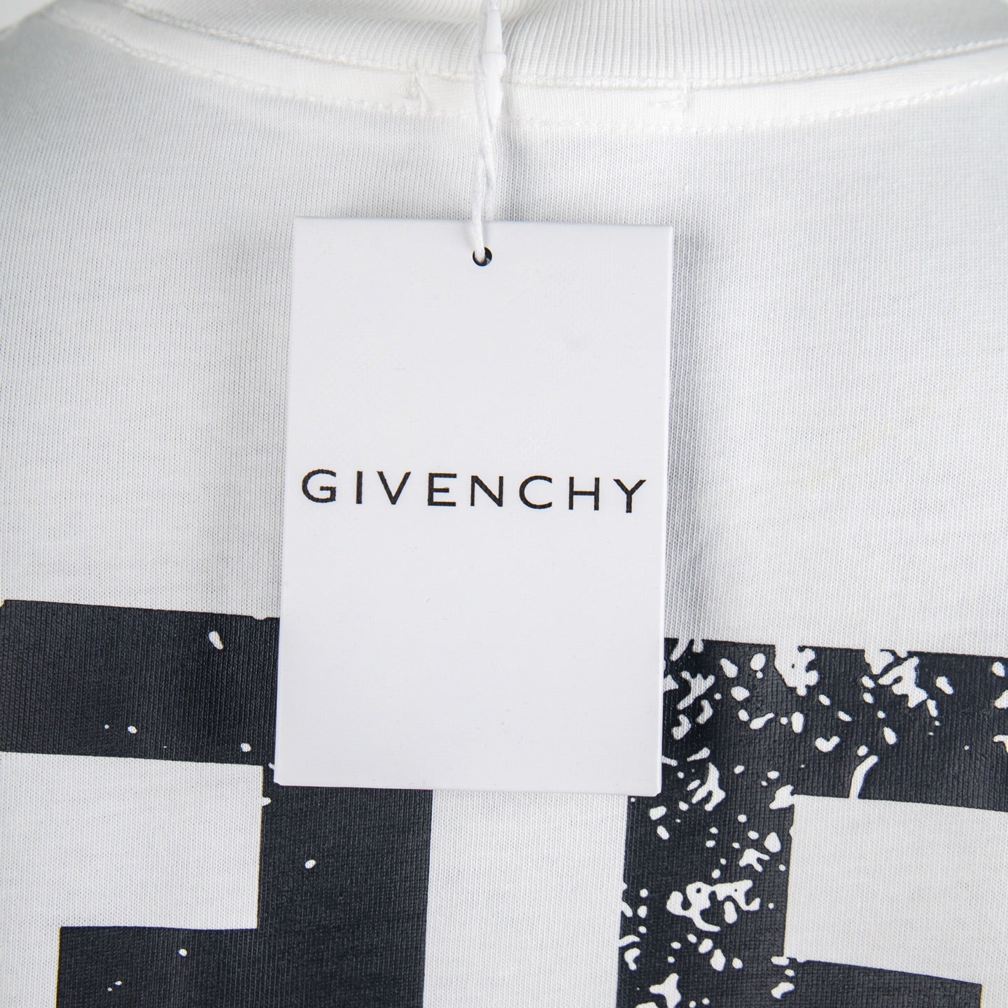 Givenchy white T-shirt with hanging tag over chest and logo graphic