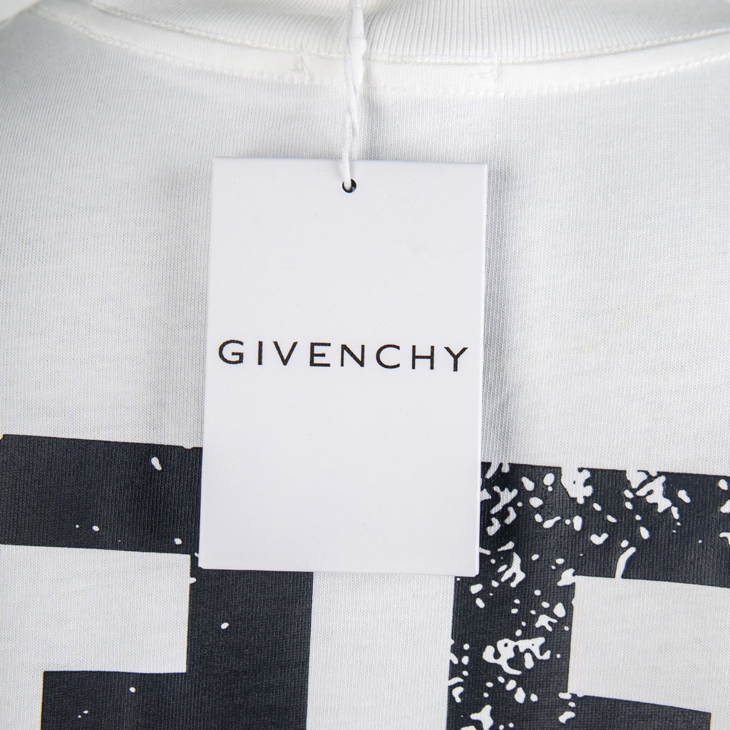 Givenchy white T-shirt with hanging tag over neckline