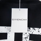 Black T-shirt with white hang tag at neckline reading Givenchy