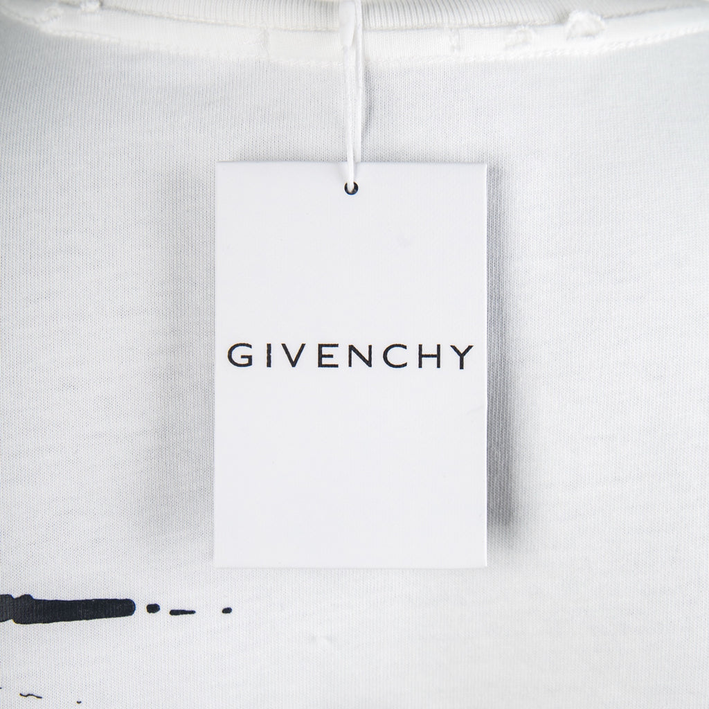 White T-shirt with hanging brand tag labeled GIVENCHY