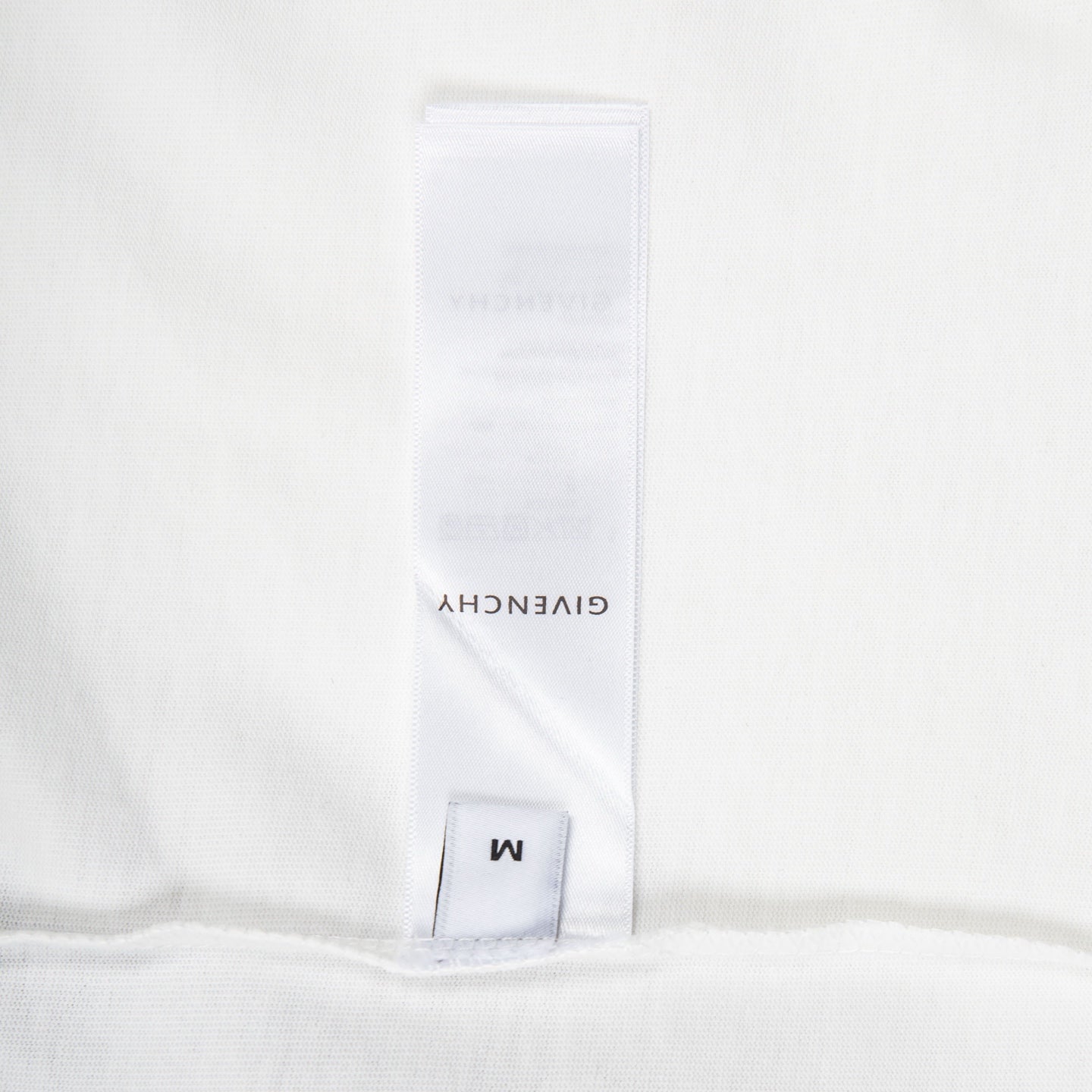 White T-shirt inner label and size tag