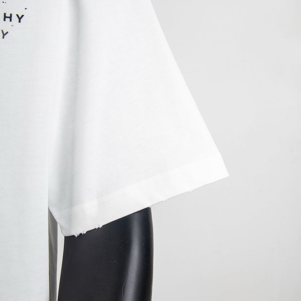White T-shirt hem and short sleeves with slightly frayed edge