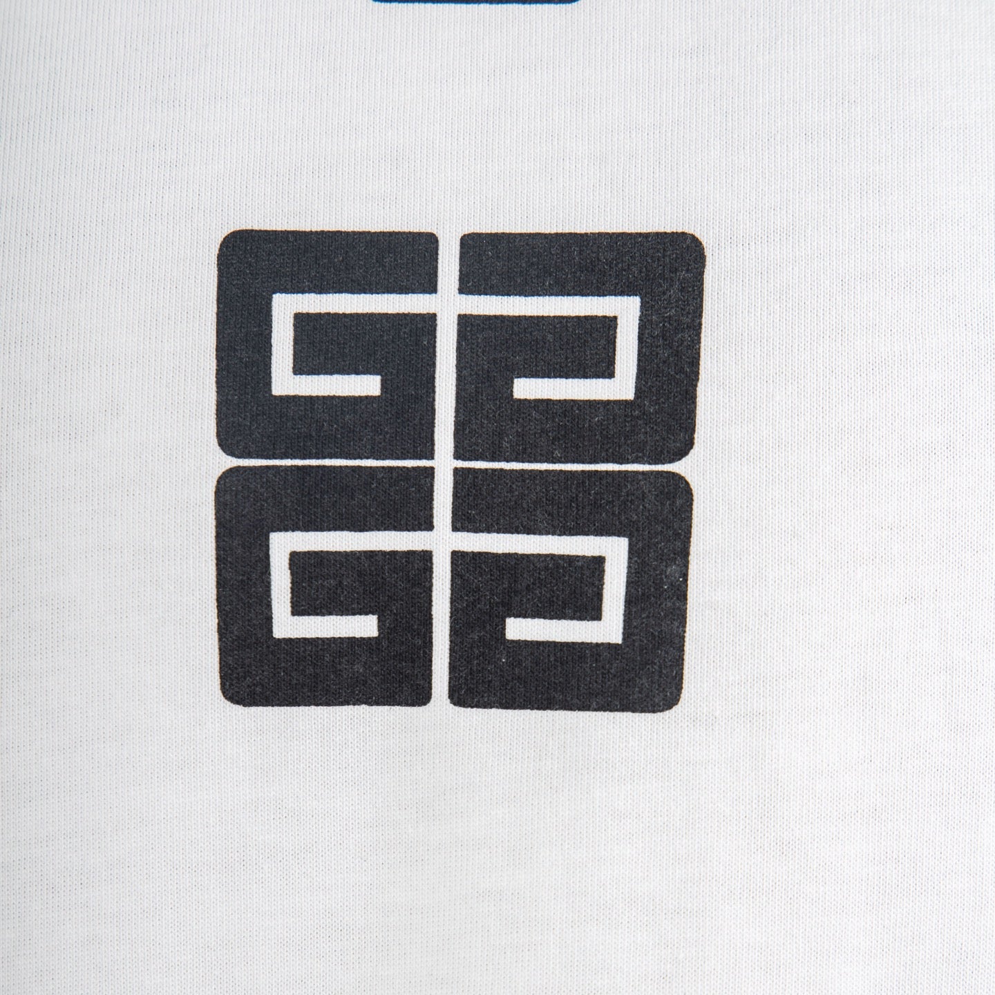 Givenchy white T-shirt close-up of black geometric logo square print