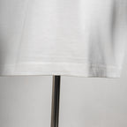 Givenchy white T-shirt hem close-up with visible stitching detail