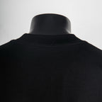 Black crewneck T-shirt with ribbed collar, plain back