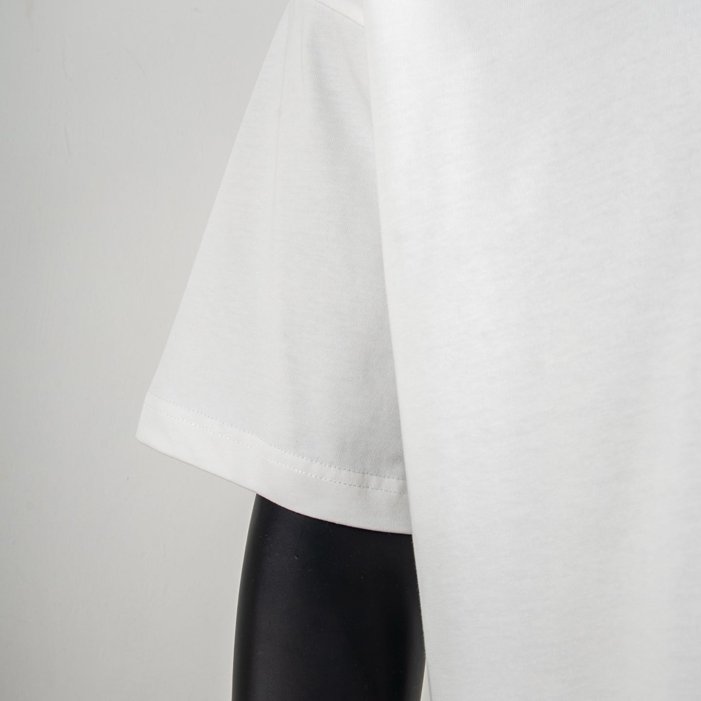 White T-shirt sleeve and side drape view