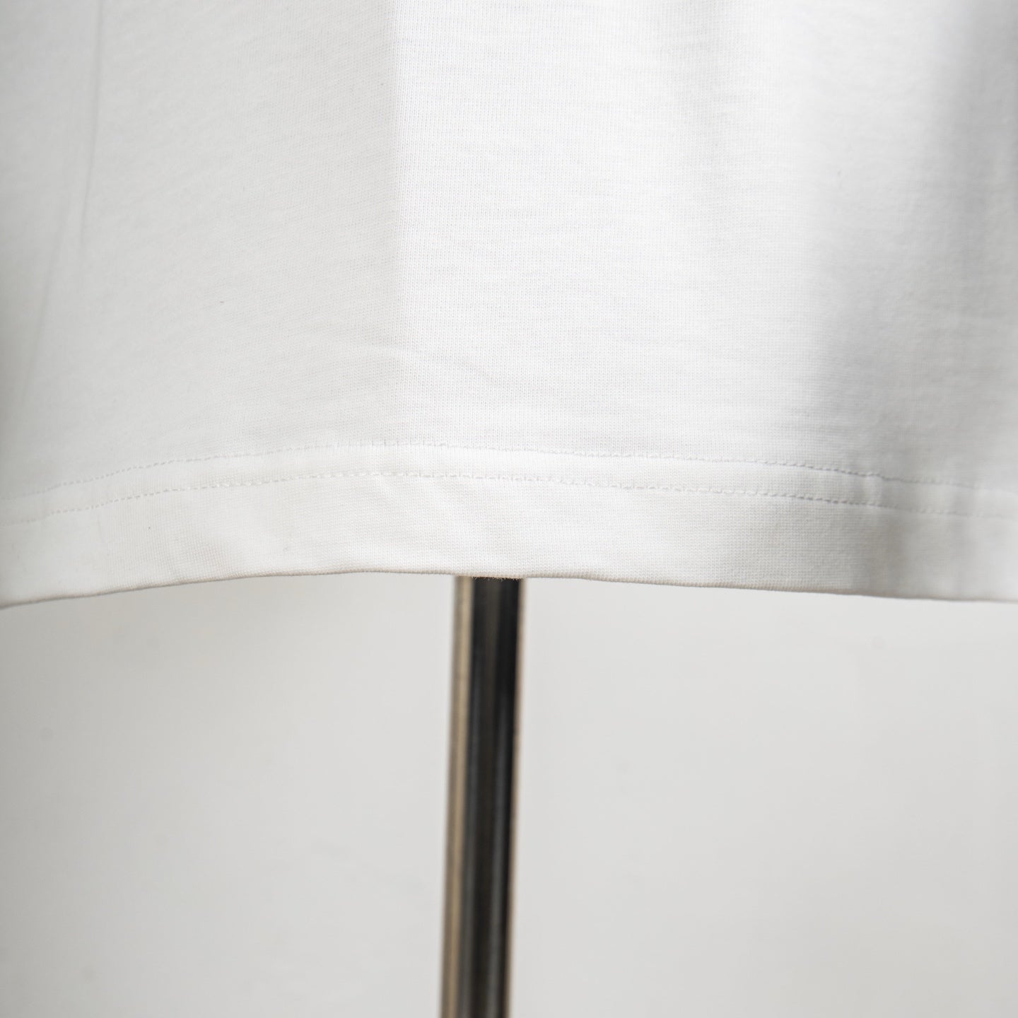 Givenchy white T-shirt hem stitching detail