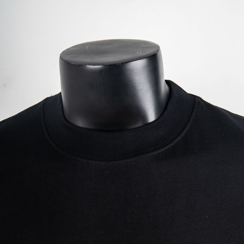 Black crew-neck T-shirt neckline on mannequin
