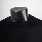Black crew-neck T-shirt neckline on mannequin