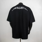 Givenchy black crewneck T-shirt with large back graphic and crown emblem.