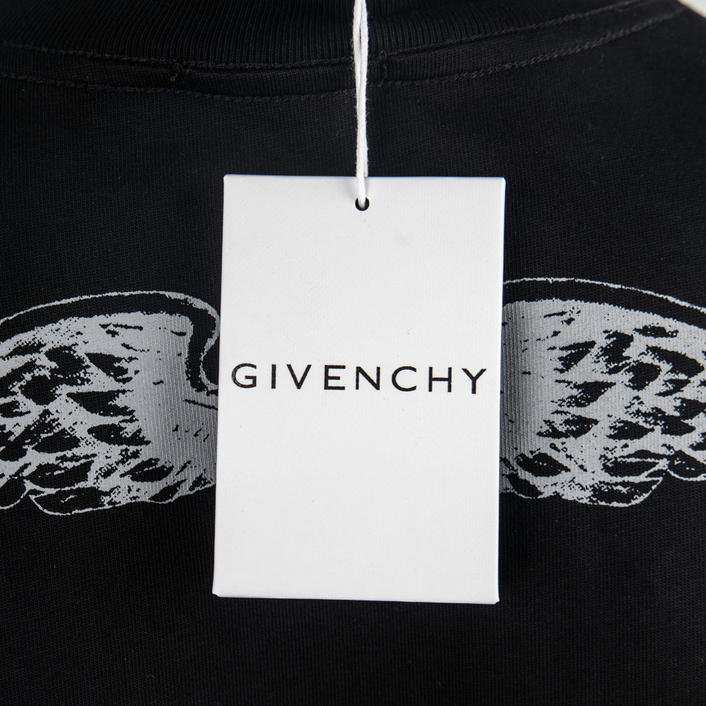 Givenchy black crewneck T-shirt with hanging GIVENCHY tag attached.