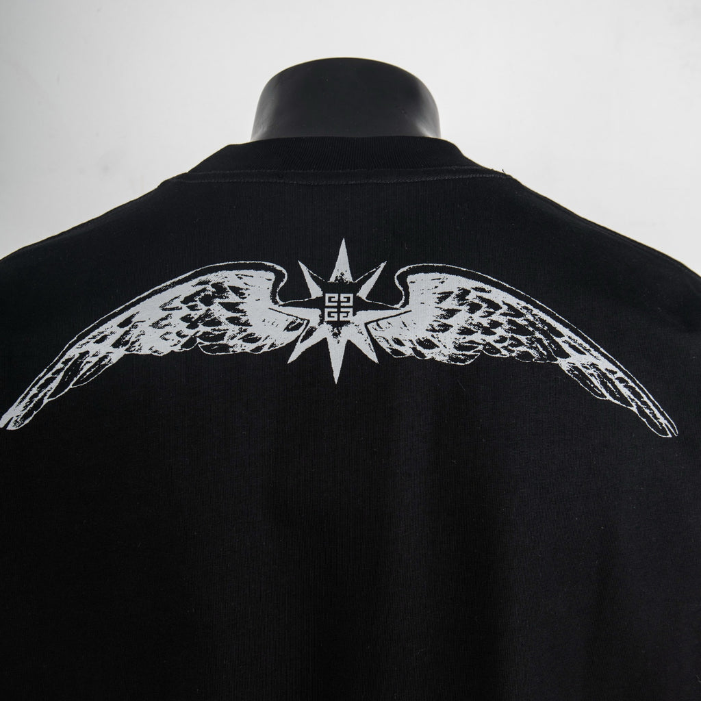 Back of black T-shirt with white winged emblem and central star