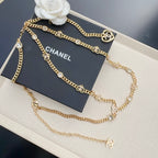 Chanel belt with gold-tone chain and heart charms, crystal links, and CHANEL logo tag