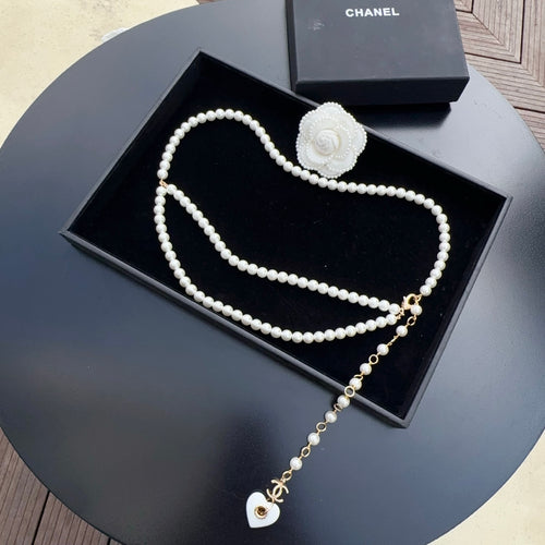 Chanel pearl belt with white rose clasp and gold heart charm, multiple strands