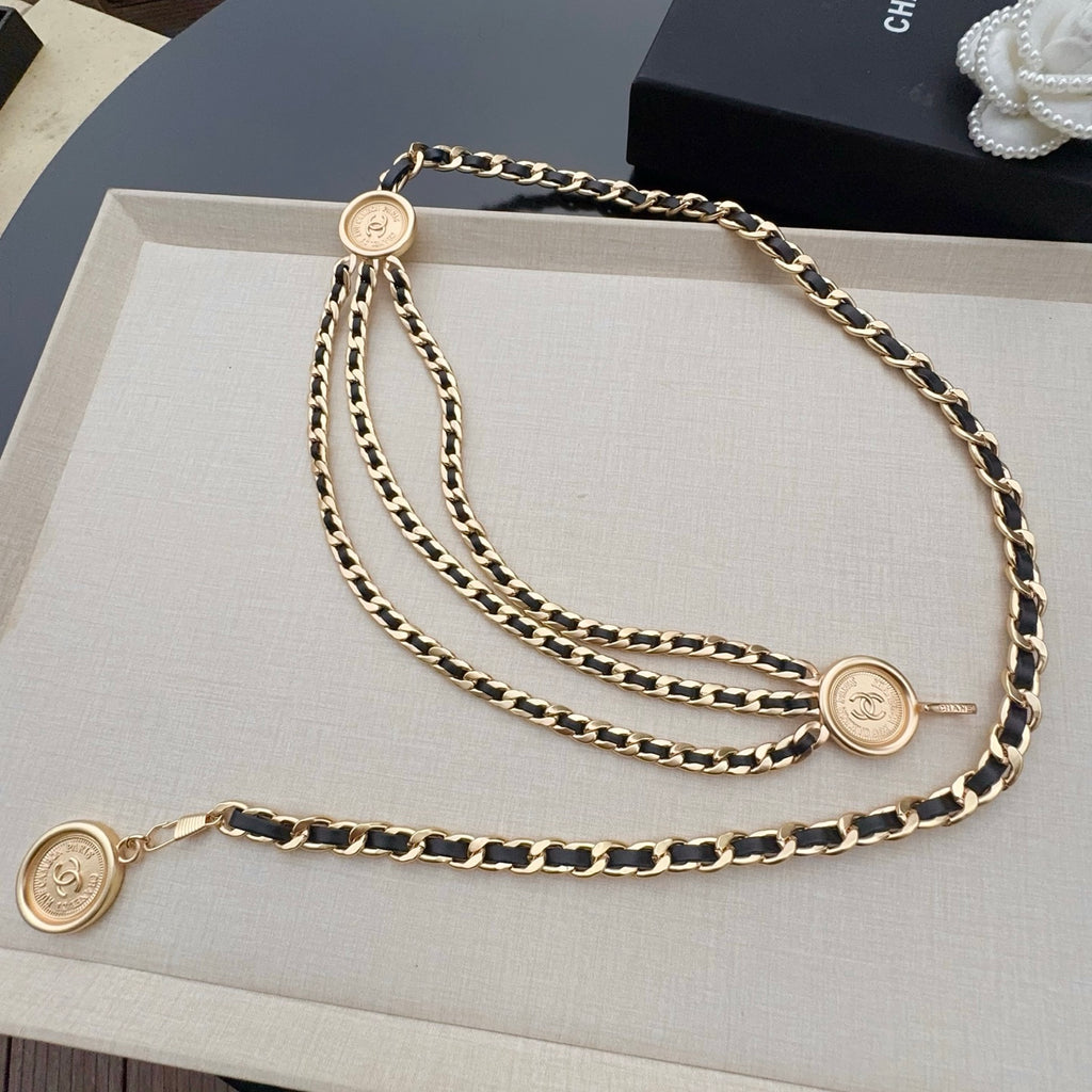 Gold-tone Chanel logo chain belt with multiple strands and round medallion charms
