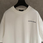 White short-sleeve T-shirt with small chest logo and crew neck