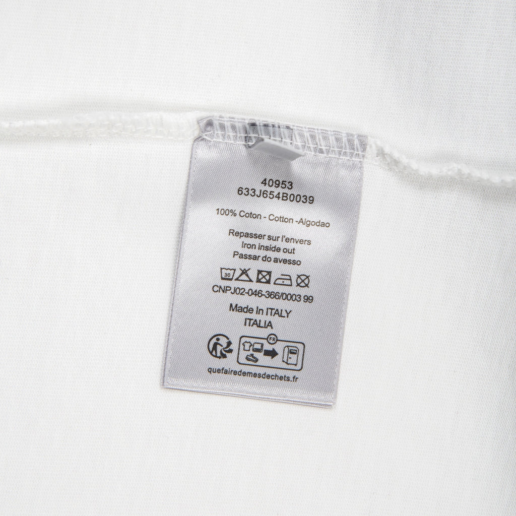 White T-shirt care label with 100% cotton and Made in Italy