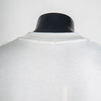 White T-shirt neckline and yoke seam detail.