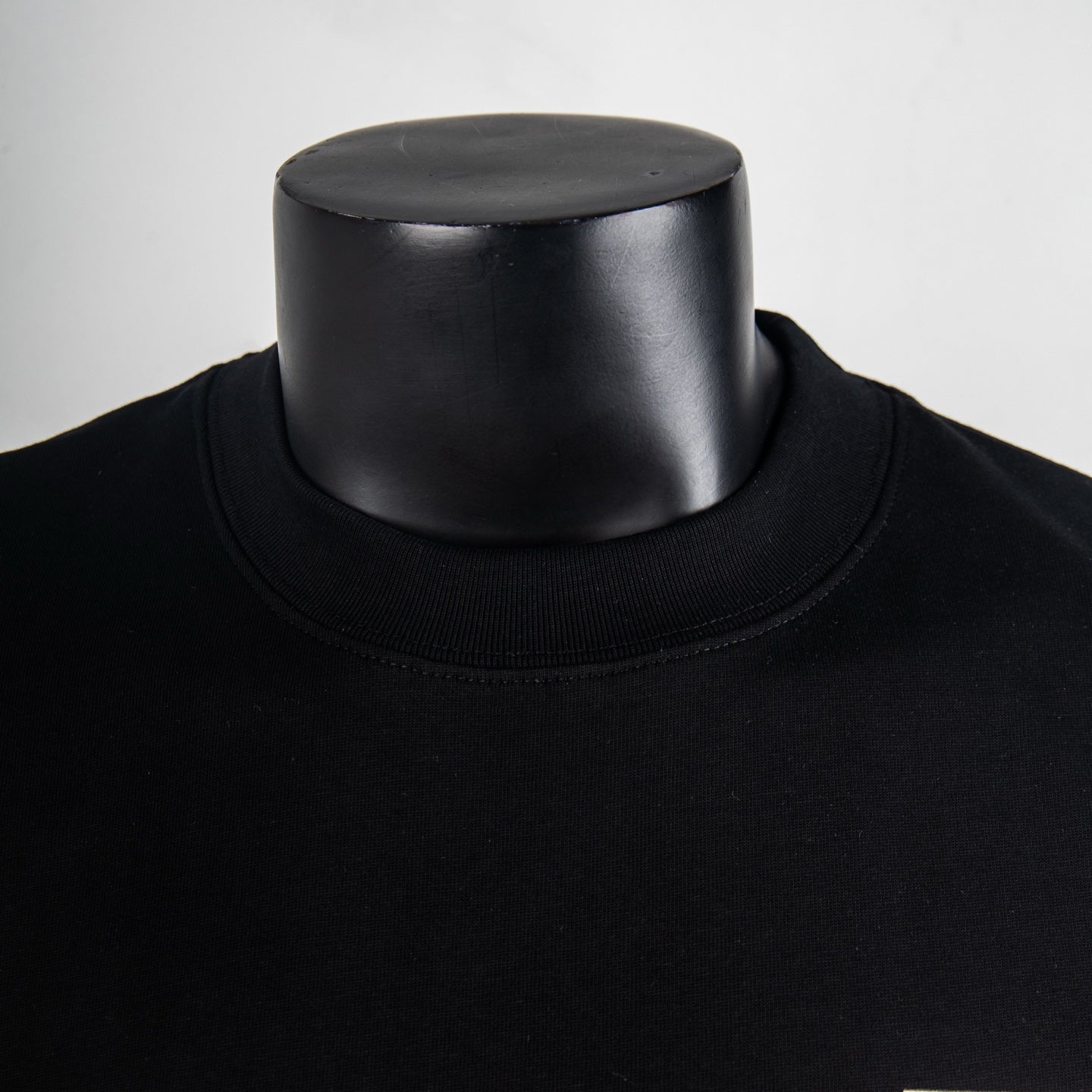 Black crewneck T-shirt collar and neckline seam