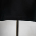 Black T-shirt hem with stitched edge