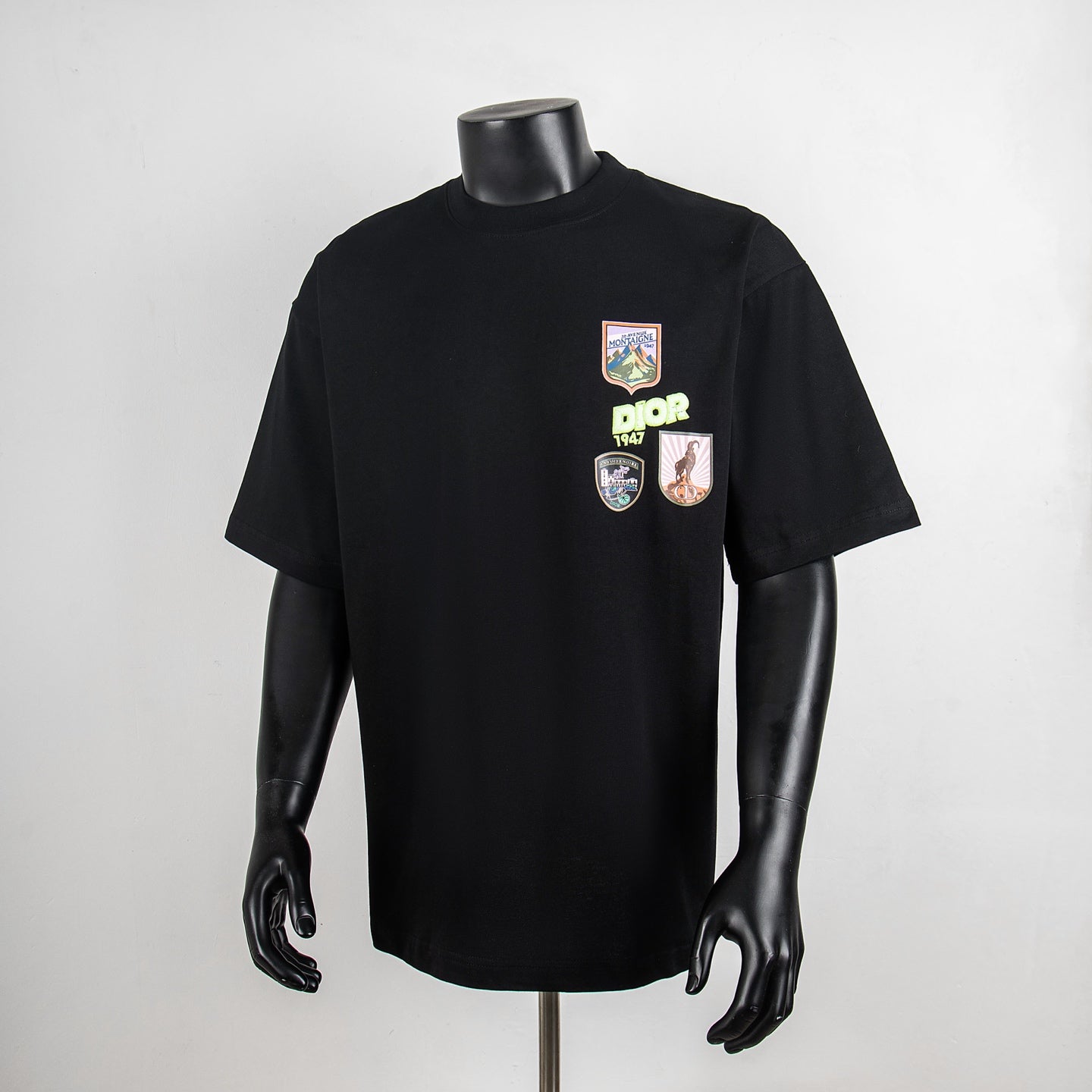 Black crewneck T-shirt with colorful front chest graphics