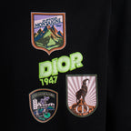 Black T-shirt front graphic patch with “DIOR 1947” text