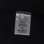 Black T-shirt inside care label with size and Made in Italia